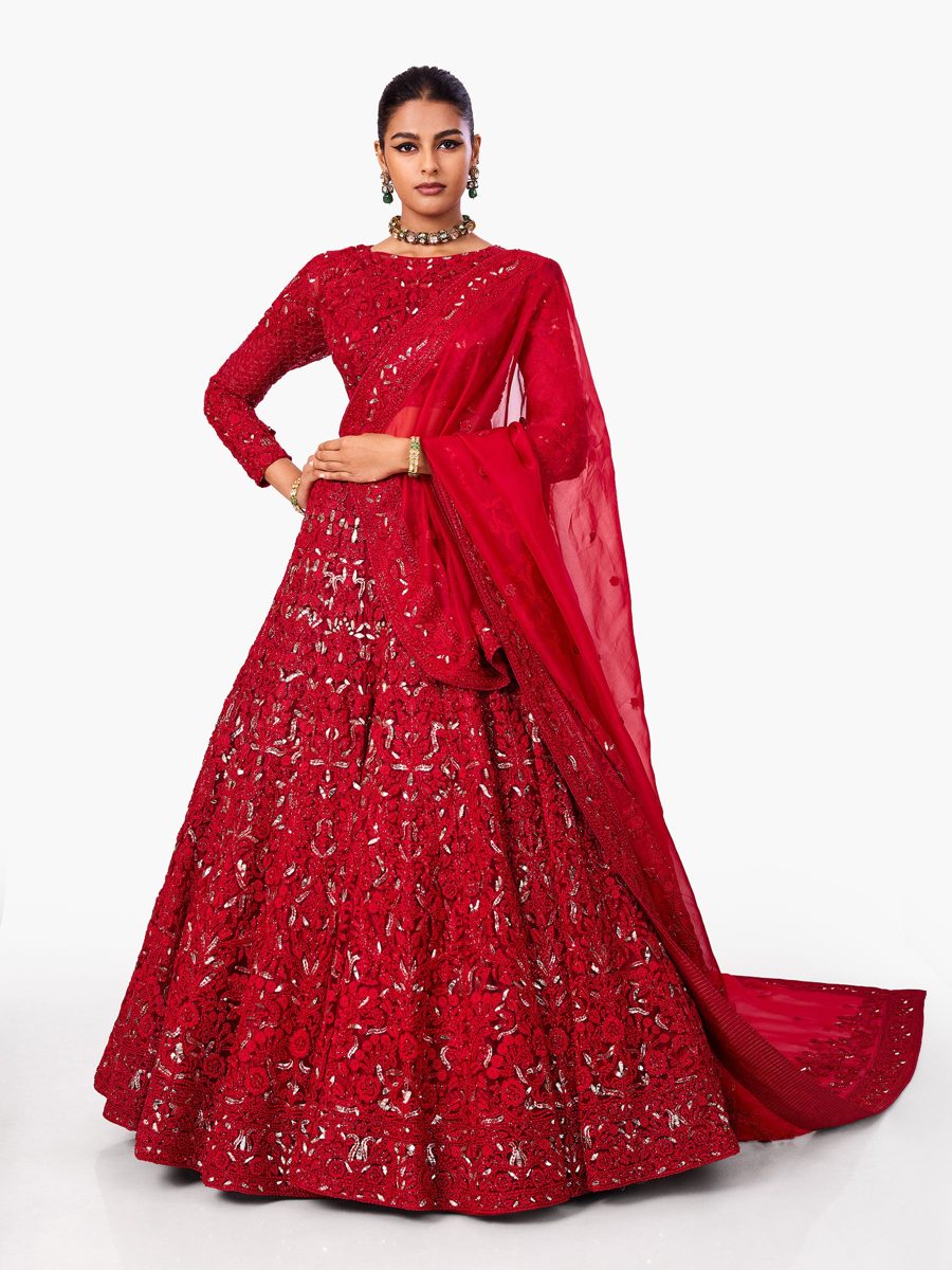 A crimson embellished lehenga with a sheer red dupatta