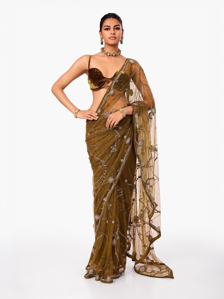 An olive net saree with fine metallic embroidery