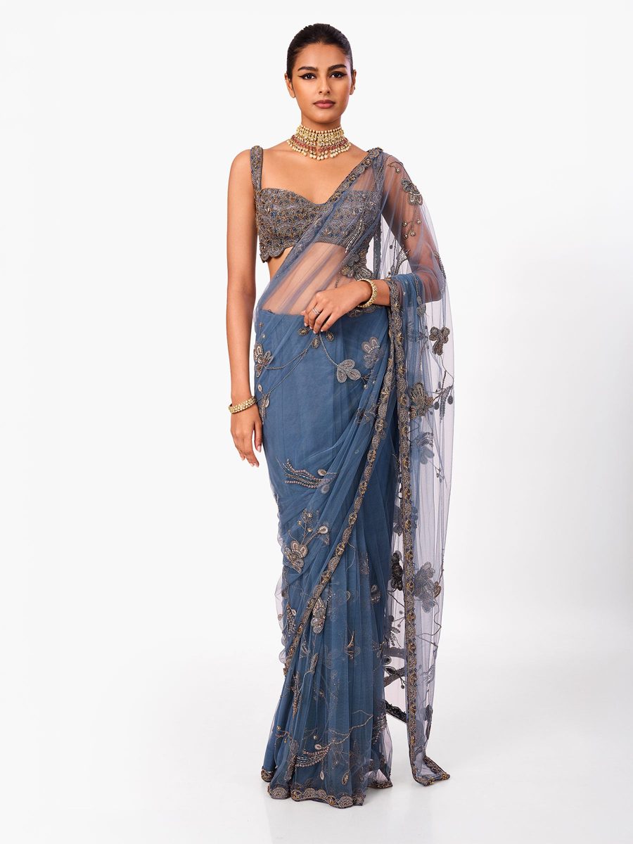A slate blue net saree with embroidered detail