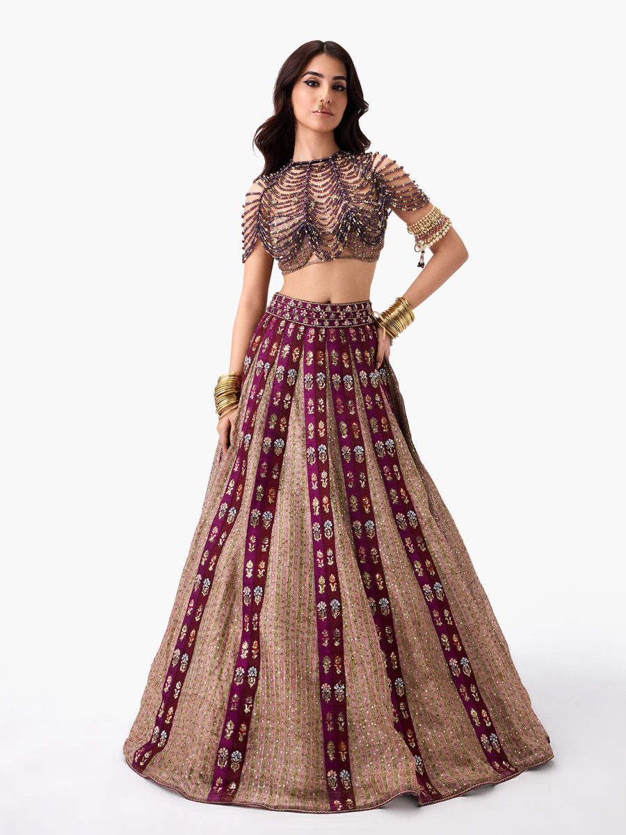 A plum and gold lehenga with a paneled skirt