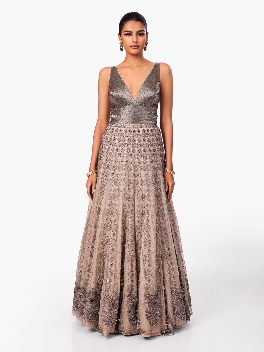 A metallic and embroidered gown with a deep neckline