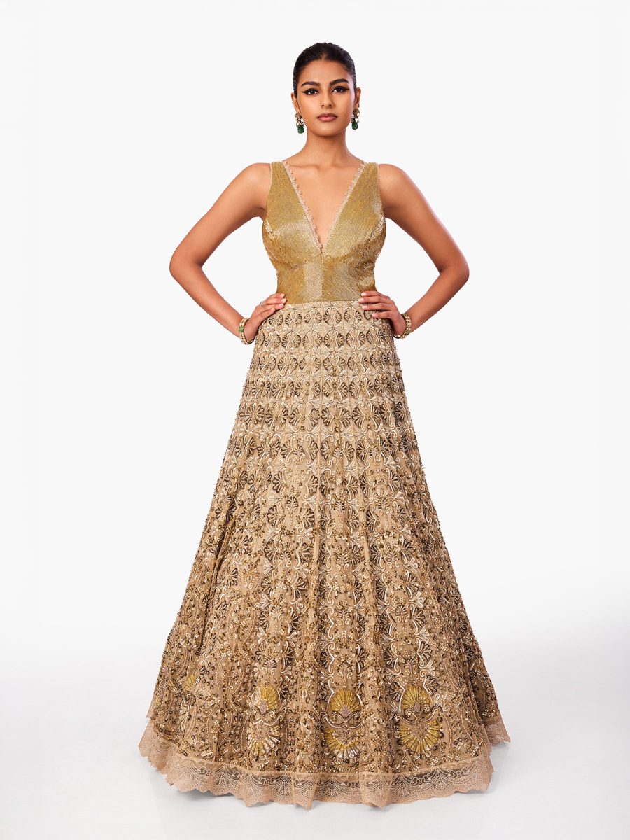 A gold gown with a fine tonal embroidered skirt