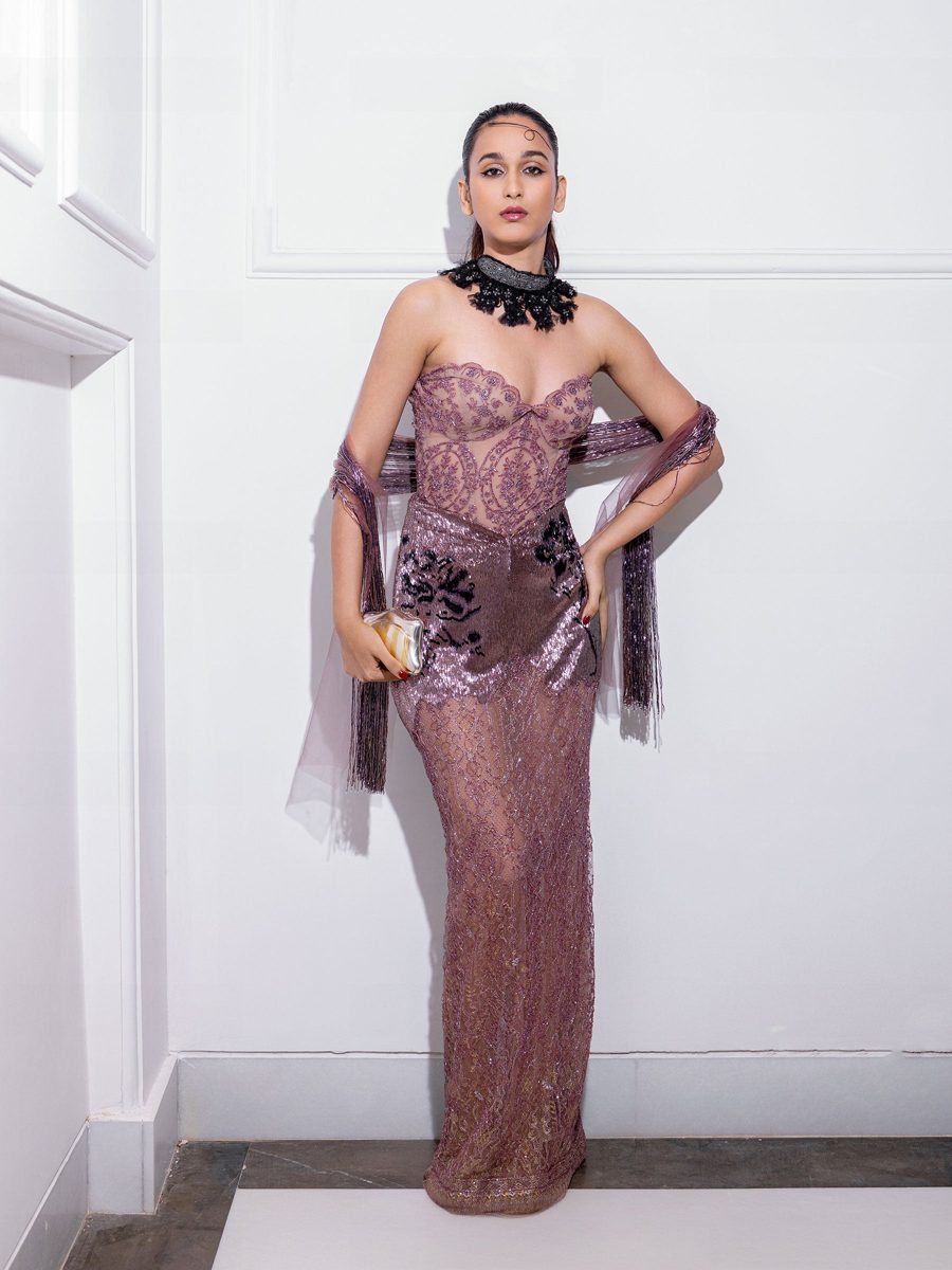 A strapless mauve gown with beaded embellishment and a matching stole
